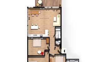 An apartment floor plan with two bedrooms, a living room, and a kitchen. The layout also shows a small balcony.