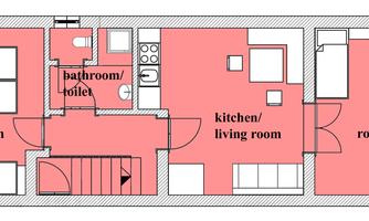 A floor plan of a house with several rooms. The layout shows a kitchen/living room, a bathroom, and two additional rooms.