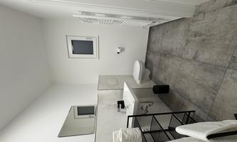 A modern bathroom with a sink, a toilet, and a large wall mirror. The gray tiles and white walls create a bright, clean atmosphere.