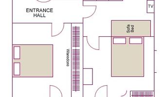 A floor plan of the Sinabell apartment with a bedroom, bathroom, and kitchen. The apartment has a balcony and is 52 square meters large.