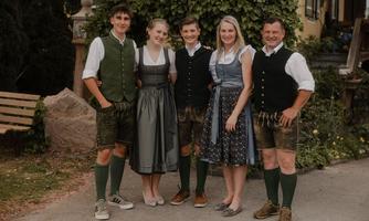 This is us - the Brugger family  
Most of the time, you will find me, Heidi Brugger, at the Schönwetterhütte.  
My husband Manfred helps out when necessary, of course, but he is mainly responsible for production.  
We have a butcher's shop on our farm, and all the delicious sausages, leberkäse, bacon, and many other treats for the Schönwetterhütte are produced in-house. In 2024, Manfred completed his training to become a master butcher alongside his main profession.  
Of course, we are also actively supported by our two children, Patricia and Gabriel.