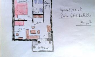 A sketched floor plan of an apartment with various rooms such as living room, bathroom, and kitchen. The area is 34 m².