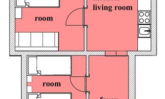 A schematic representation of an apartment with different rooms. The areas are labeled as kitchen/living room, bathroom/toilet, as well as two bedrooms and a foyer.