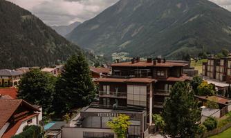 ARX Boutique Hotel - a modern accommodation nestled in a picturesque mountain landscape. Surrounded by trees and breathtaking views of the mountains.