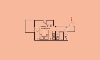 A floor plan of an apartment with a living room, bedroom, bathroom, and toilet. The rooms are clearly drawn, and there is access through a door.