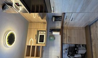 Kitchen next to entrance on the left.