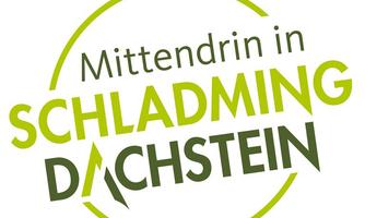 A logo with the text "Mittendrin in Schladming Dachstein". It uses green colors and a modern design.