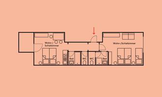 A simple floor plan drawing of a building. It shows several rooms, including a bathroom and toilet, on an orange background.