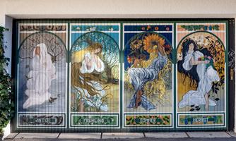 A colorful mural depicts the four seasons: winter, spring, summer, and autumn. Each representation is unique and conveys the atmosphere of the respective season.