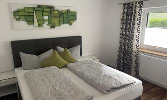 A modern bedroom with a double bed and cozy pillows. A decorative artwork hangs on the wall and the window lets in plenty of daylight.