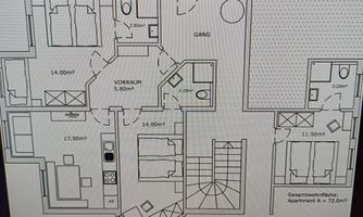 A floor plan of an apartment with several rooms. The rooms are clearly arranged, including an entrance area and stairs.