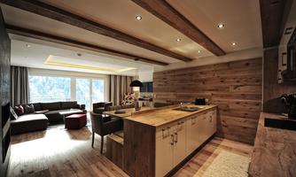 A modern kitchen with wooden details and an open living area. Large windows provide natural light and a welcoming atmosphere.