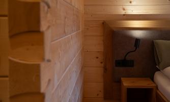 A cozy room with solid wood block construction and gentle lighting. The design is modern and inviting.