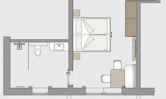 A floor plan drawing of a room with a bedroom, a bathroom, and a small kitchen. The room is designed to be modern and functional.