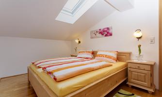 Ferienwohnung Walchsee Schlafzimmer zwei Bett