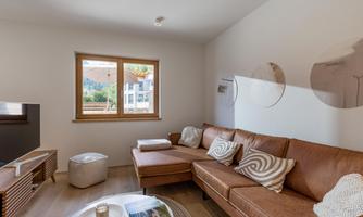 Kaiserwinkl Hideaway_Walchsee_Wohnraum_Couch