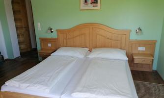 Das zusätzliche Schlafzimmer mit separatem Eingang