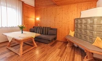 living room with electric kachelofen