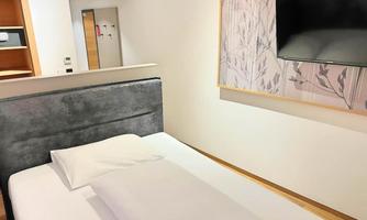 Our newly renovated Kingsize Single Room offers modern comfort in a compact space. Featuring a spacious kingsize bed, stylish interior, and high-quality amenities, it is the perfect choice for solo travelers who appreciate comfort and quality.