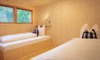 A separate bedroom and a cozy sleeping alcove with a panoramic window on the upper floor offer space for up to four people. The beds will be made up for you upon arrival.