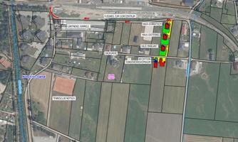 An overview map of a residential area with streets and buildings. The map shows various color codings for specific locations and facilities.