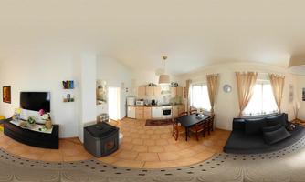 A modern apartment with an open kitchen and a cozy living area. Large windows ensure plenty of natural light.