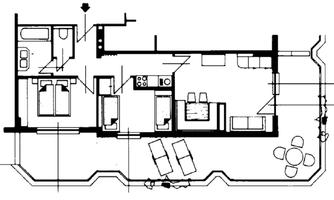 A floor plan of an apartment with two bedrooms, a bathroom, and an open living area. The kitchen and dining area are drawn adjacent to the living spaces.
