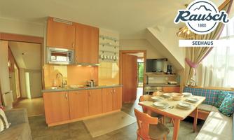 A bright and modern kitchen with wooden cabinets and a cozy seating area. The space is inviting and well equipped.