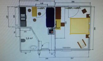 A floor plan of an apartment with two rooms. The layout shows a kitchen, a living area, and a bedroom.