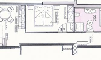 An apartment with an open living and dining area as well as two bedrooms. The bathroom and kitchen are also indicated.