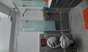 Bathroom with shower, sink, and toilet