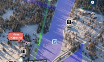 A map of a ski resort with a reference to "Haus Karoline". The areas marked in blue indicate the skiing trails and the surroundings.