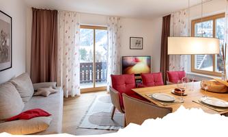 A cozy living room with a dining area and a large window front. The decor is modern and inviting, with a television and a view of the Alps.