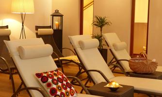 A relaxing wellness area with loungers and soft lighting. The room radiates calm and comfort.