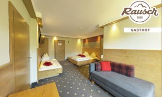 A cozy room with two beds and a sofa bed. The walls are bright and designed in a modern style, with an inviting ambiance.