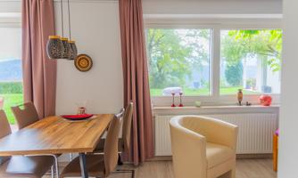 The view from the dining table goes directly into the greenery.  
Children see the garden, adults enjoy the calm and the light that falls through the large windows.