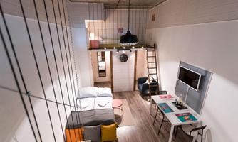 A modern apartment with an open floor plan. The living area is bright and friendly, with a cozy seating corner and a dining area.