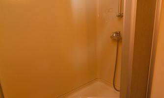 A modern shower with clean lines. The interior is designed to be bright and clean.