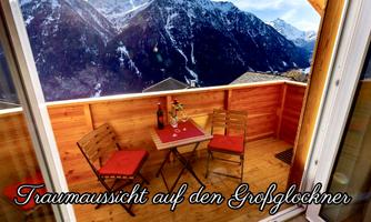 A cozy terrace with a view of the Großglockner. Two chairs and a small table are ready for a relaxing moment.