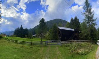 Access by car directly to the mountain hut with secured parking.  
Surrounded by beautiful scenery with green meadows and mountain panorama.