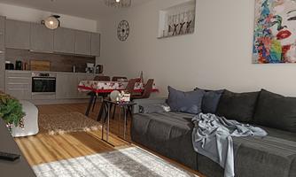 A modern living room with a gray sofa and a wooden table. In the background, there is an open kitchen and there are decorative elements on the wall.