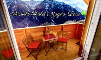A quiet balcony with a table and two chairs awaits the guests. In the background are majestic mountains covered with snow.