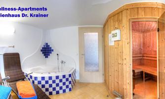 A cozy wellness area with a whirlpool and a sauna. Relaxing loungers invite you to linger.