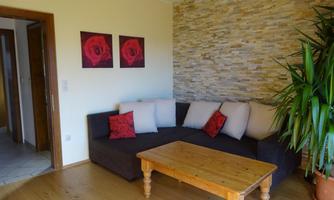 Phlox Wohnzimmer mit Schlafsofa