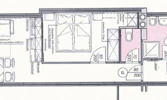 A floor plan of an apartment with one bedroom, bathroom, kitchen, and living area. The space is clearly structured and shows the arrangement of the furniture.