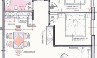 A floor plan drawing of an apartment with two bedrooms, a bathroom, and a living area. The dining area is equipped with a large table and chairs.