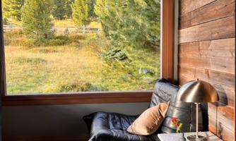 From the living-dining area you have a great view of the surrounding forests and mountains.