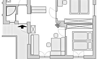 A simple floor plan drawing of an apartment with two bedrooms, one bathroom, and an open living kitchen. The furniture arrangement is clearly visible.