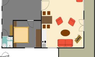 A simple floor plan drawing of an apartment. There is a living room, a bedroom, and a bathroom, with furniture and a kitchen.