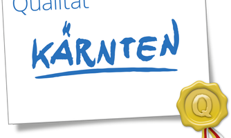 A certificate with the word "Quality" and "Carinthia" in blue letters. At the bottom, there is a golden seal with a "Q".